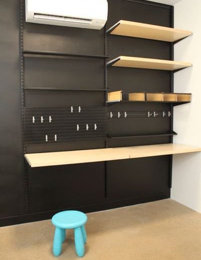home office black walls and black shelving